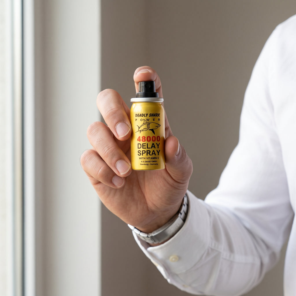 Pocket sized Deadly Shark delay spray bottle held in a hand